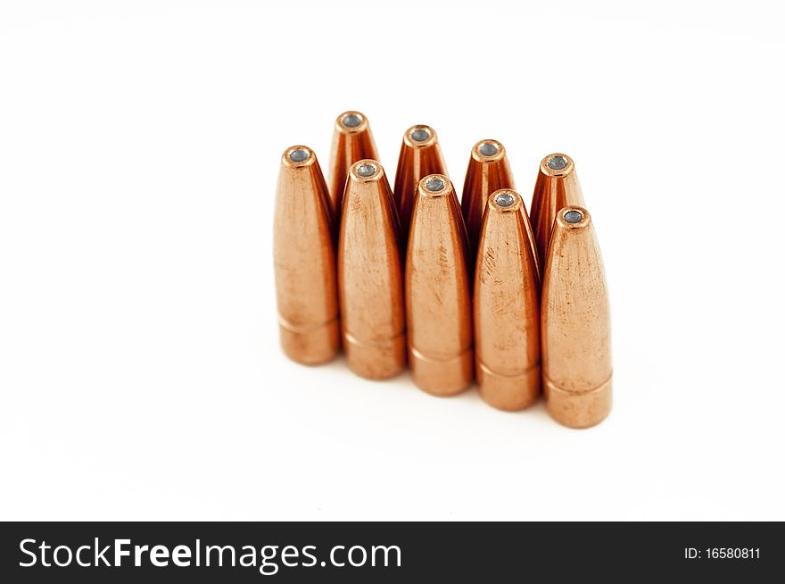 Bullets standing against a white background. Bullets standing against a white background.