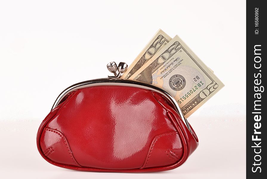 Red clutch purse with  twenty dollar bills. Red clutch purse with  twenty dollar bills