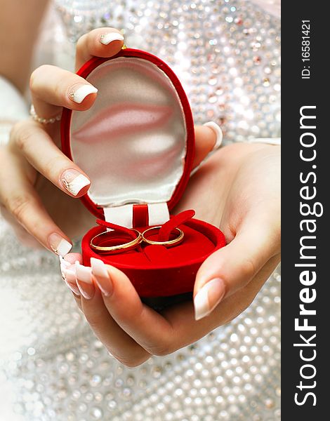 Wedding rings in bride hands