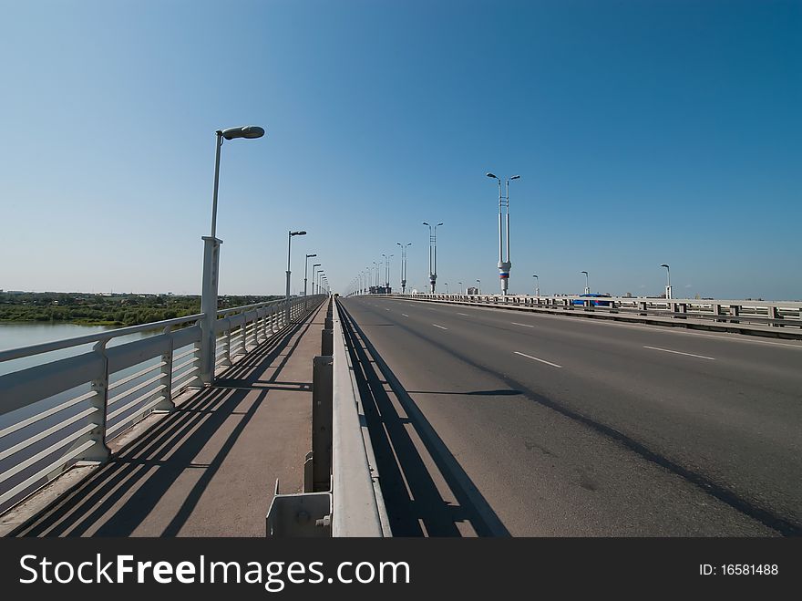 Bridge over water with laterns on the sky background. Bridge over water with laterns on the sky background