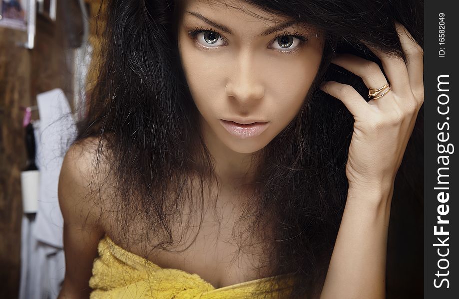 Beautiful young woman with yellow ring. Beautiful young woman with yellow ring