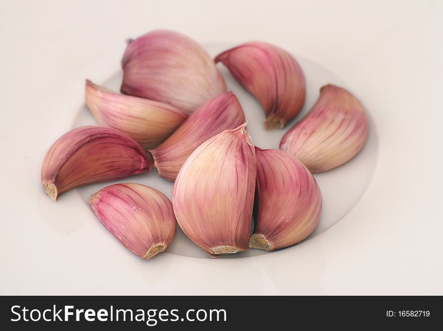 White dish with several garlics. White dish with several garlics