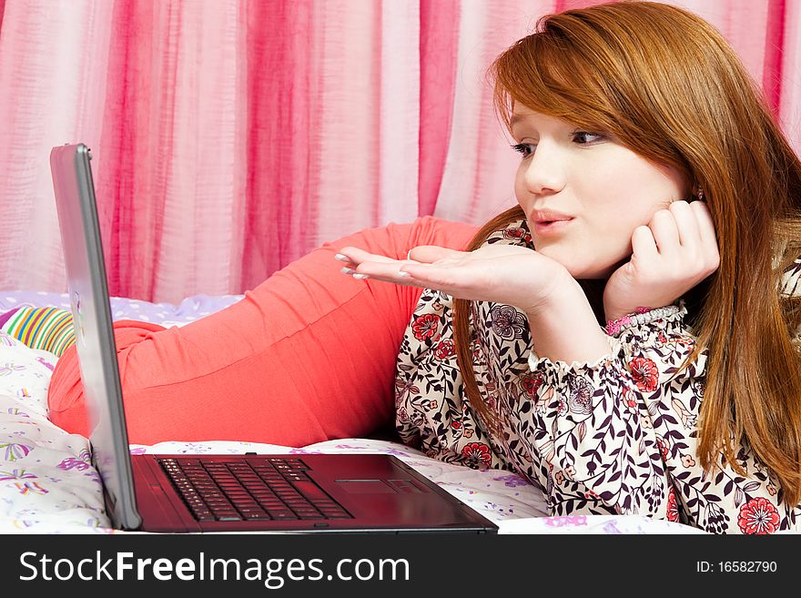 Portrait of beautiful red-haired girl with laptop. Portrait of beautiful red-haired girl with laptop