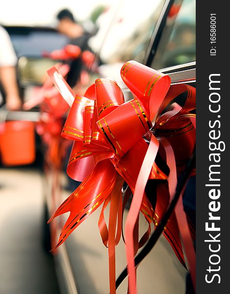 Red silk ribbons on Wedding car. Red silk ribbons on Wedding car