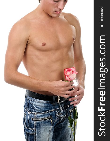 A fragment of man body in blue jeans and red rose. A fragment of man body in blue jeans and red rose