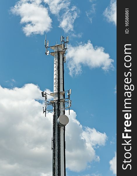 White Antenna Tower With Blue Sky And Clouds