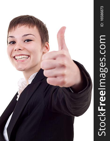 Thumbs Up! Studio partrait of young business woman showing OK sign, looking at camera and smiling. Isolated on white background