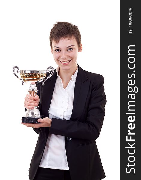 Portrait of a confident young business woman holding a silver cup against white background