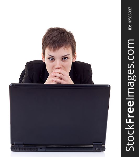 Closeup portrait of a young woman using laptop and thinking. Closeup portrait of a young woman using laptop and thinking