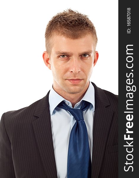 Portrait of a handsome young businessman staring against isolated white background