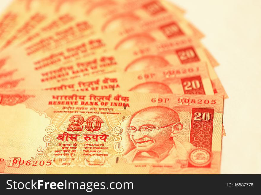 Indian twenty rupee bills arranged in a fan. Indian twenty rupee bills arranged in a fan