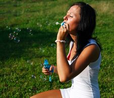Girl Blowing Bubbles Stock Photos
