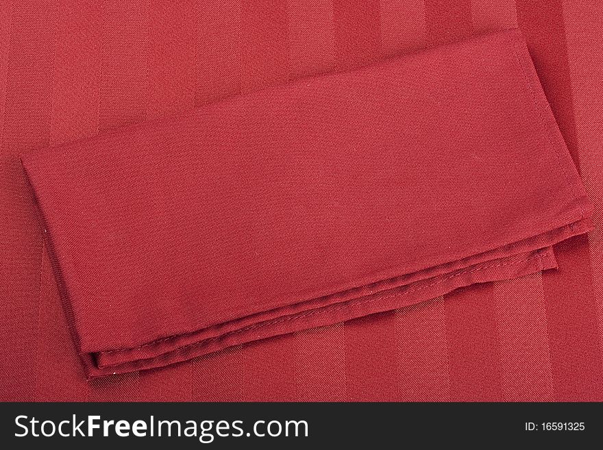 Table napkins of cloth on a red background.