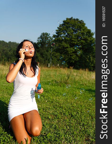 Girl making soap bubbles