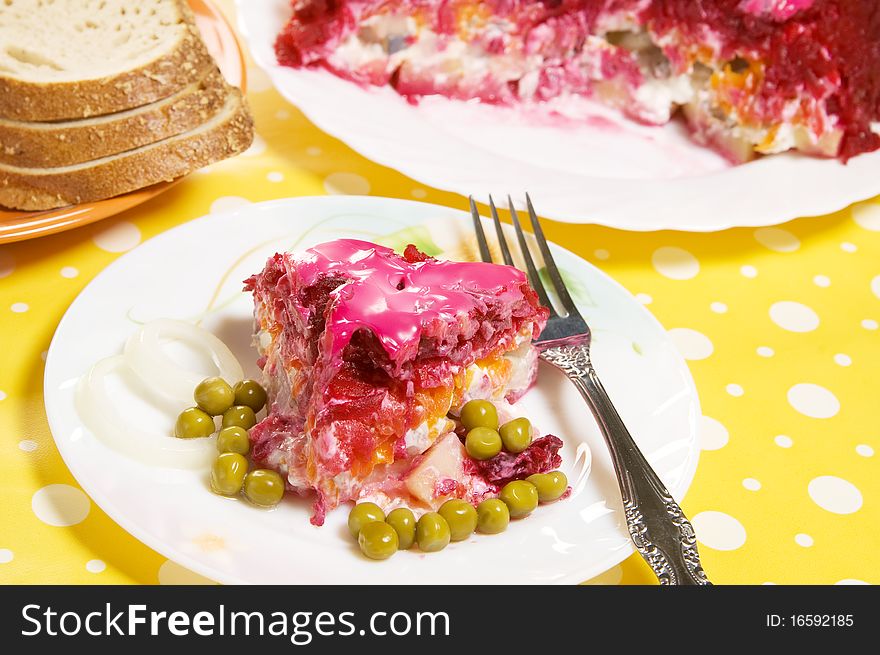 Plate with vegetable salad on a served table