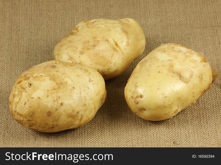 Linen background in three potato