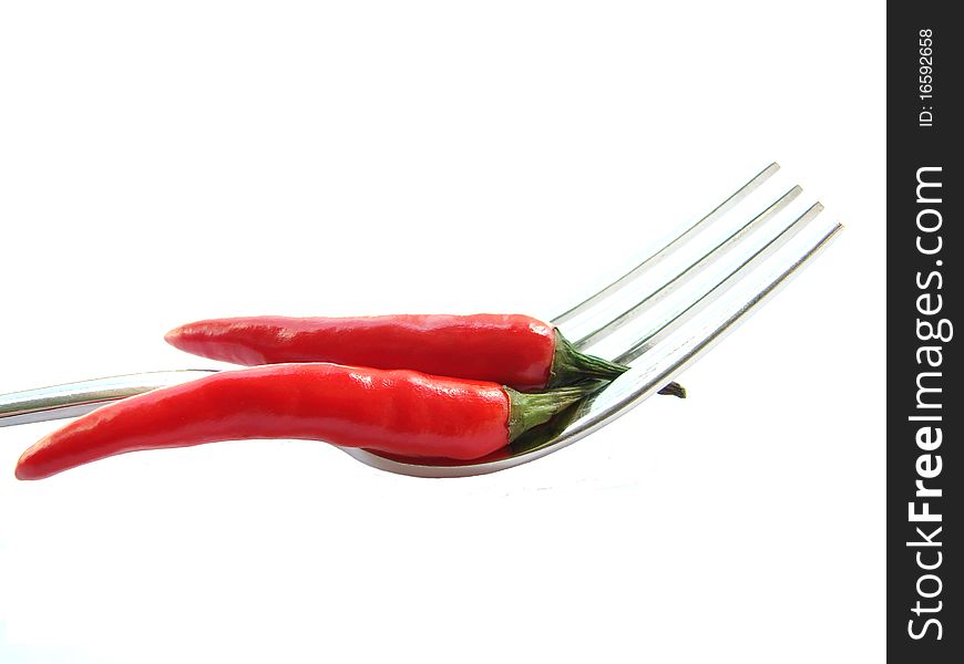 Red chili peppers on the fork