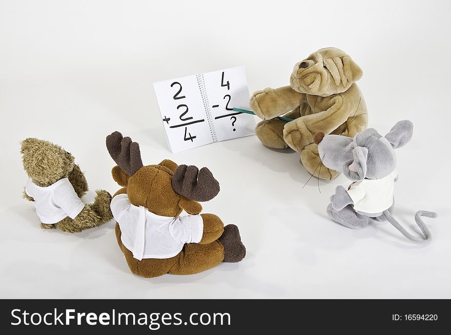 This image shows four teddy bears in math class. This image shows four teddy bears in math class
