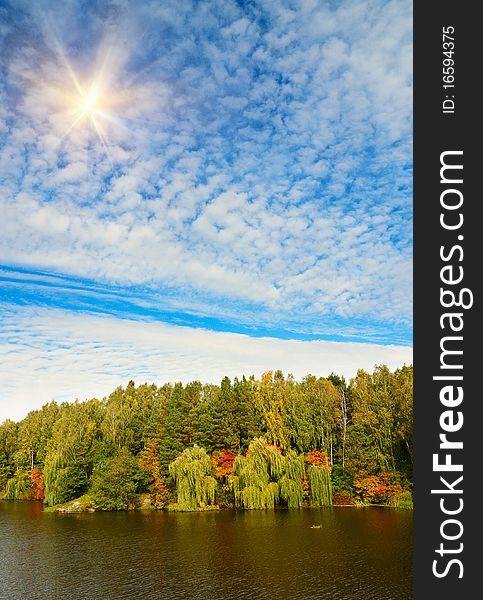 Autumnal landscape of lake and blue sky. Autumnal landscape of lake and blue sky.