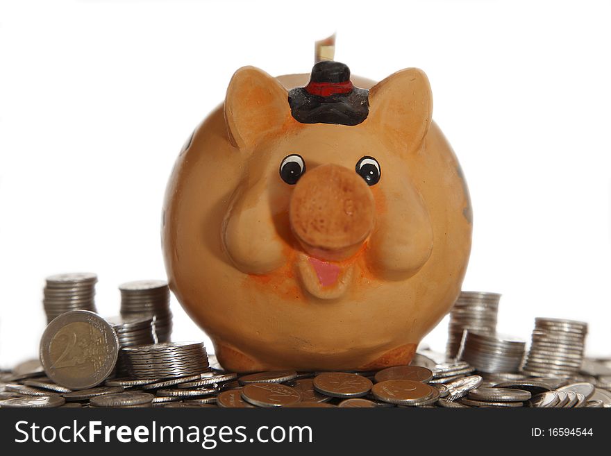 Piggy bank on coins with white background