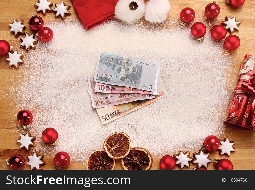 Merry christmas still life with money and some red christmas balls