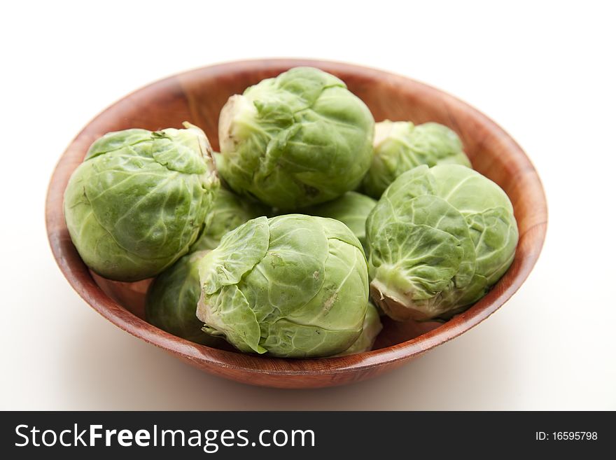 Brussels sprouts in the wood bowl. Brussels sprouts in the wood bowl