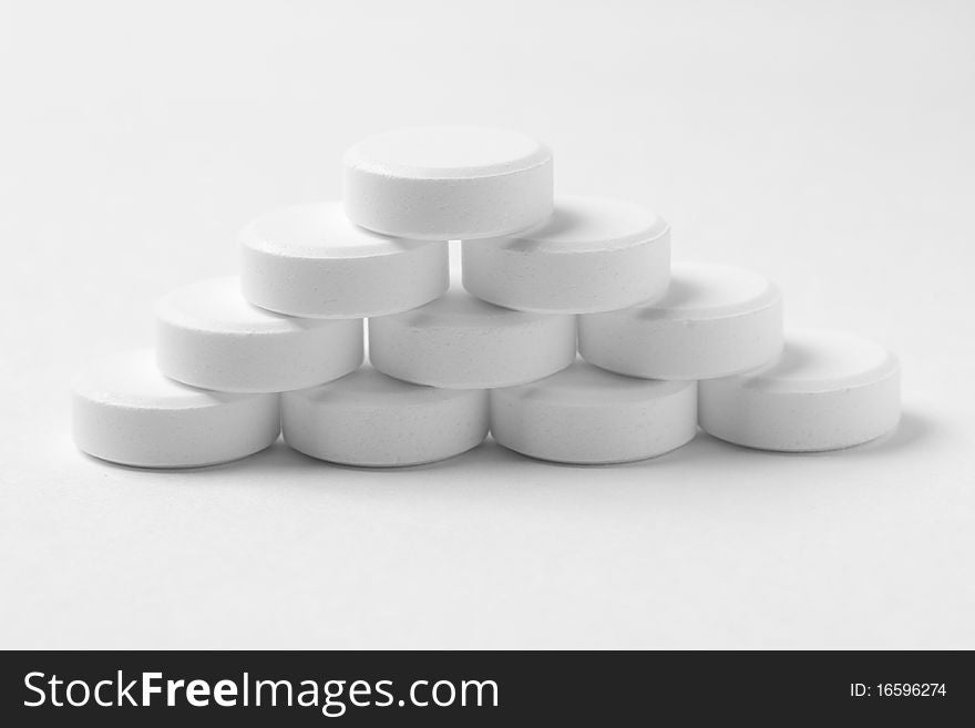 Piramidal Pile Of Tablets On Gray