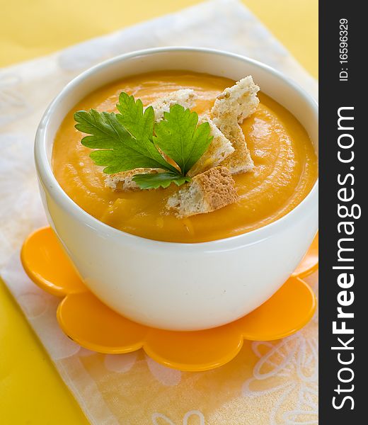 Delicious and creamy pumpkin soup in bowl