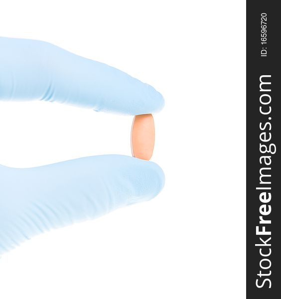 Hand holding pill doctor on a white background. Hand holding pill doctor on a white background