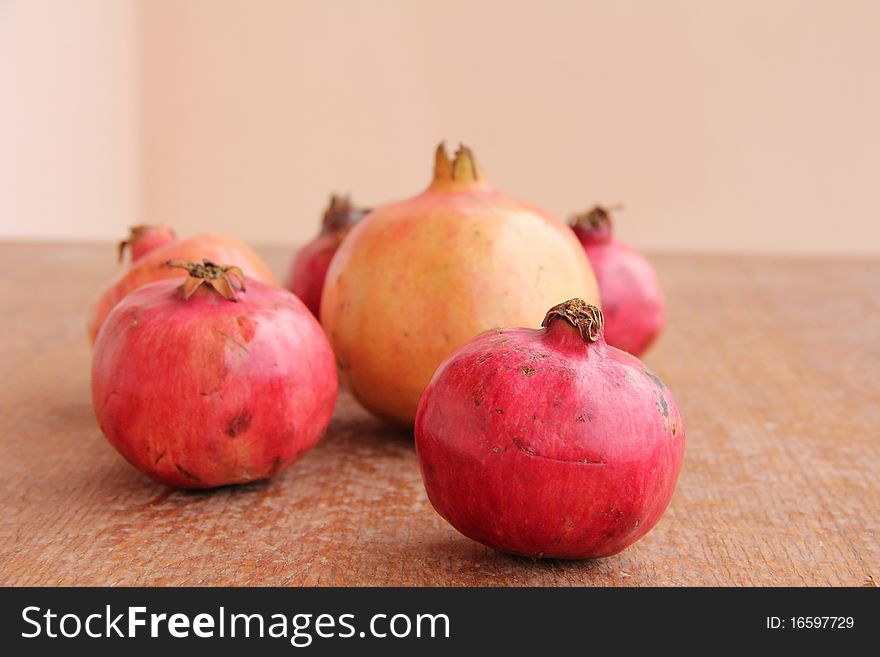 Ripe Pomegranate at wooden structure
