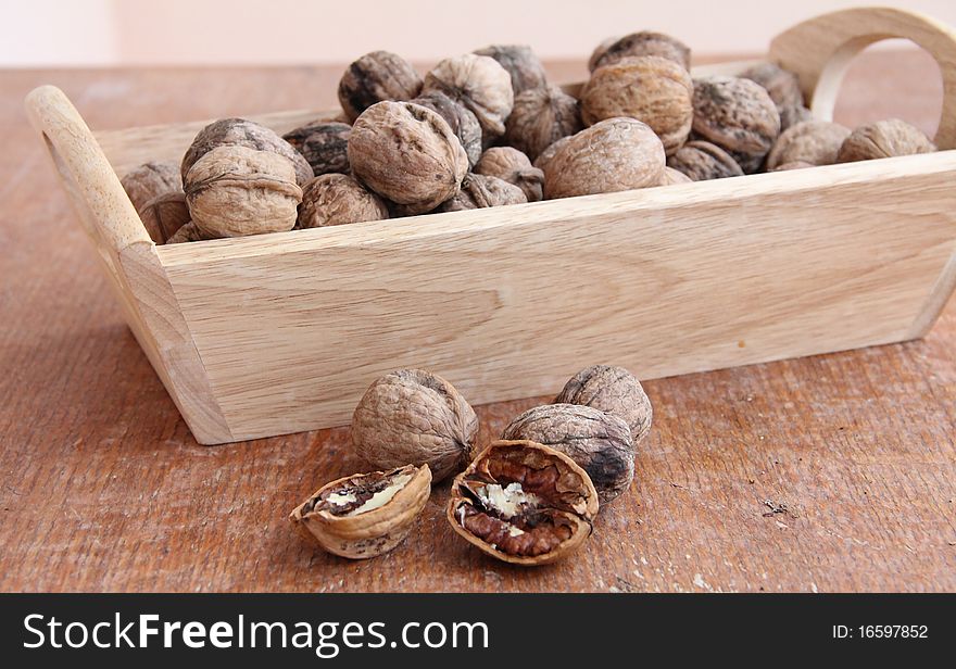 Macro view of walnut on a wooden structure