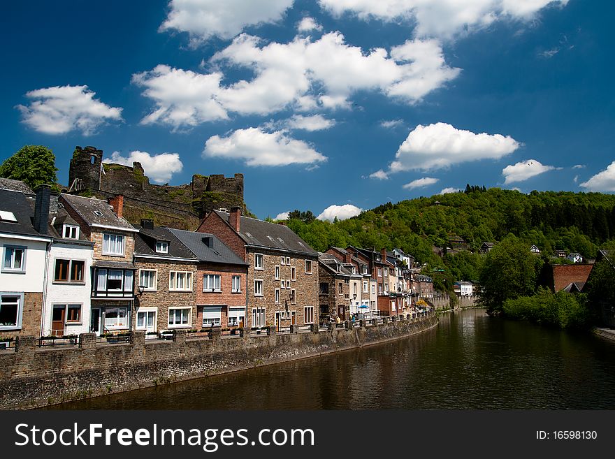 Traditional european houses in Ardennes on a bank of a river. Traditional european houses in Ardennes on a bank of a river