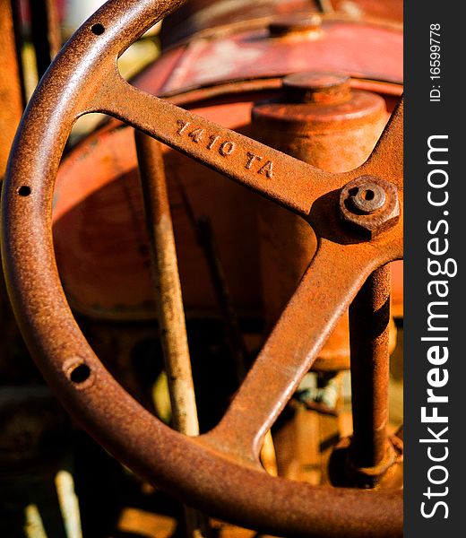 A vintage Tractor steering wheel rusted