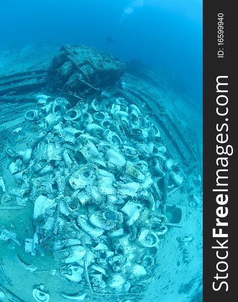 The Cargo of the Yolanda shipwreck scattered over the ocean floor. Red sea, Egypt. The Cargo of the Yolanda shipwreck scattered over the ocean floor. Red sea, Egypt.