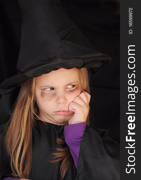 Masked girl in witch for Halloween. Masked girl in witch for Halloween