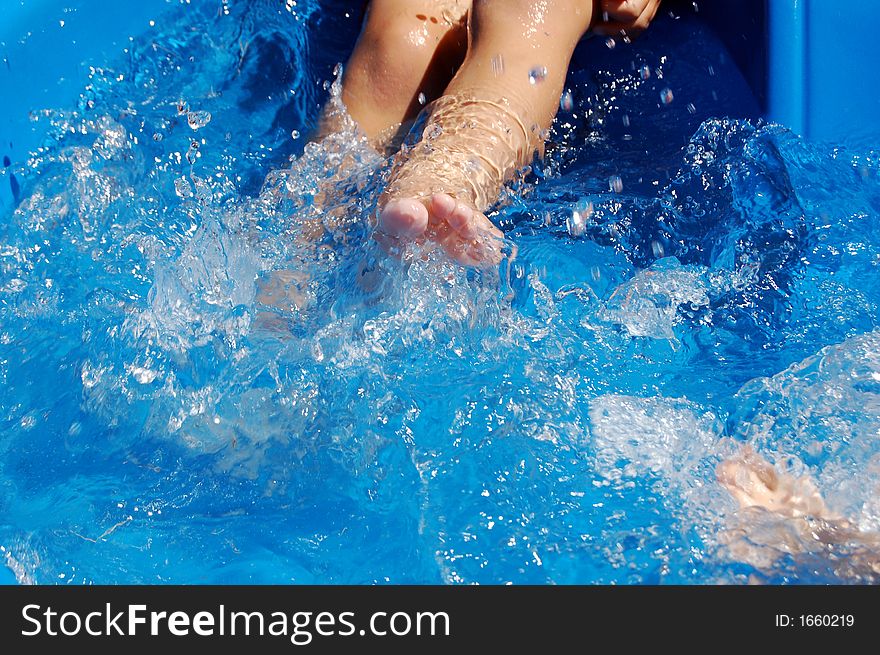 Boy Kicking In Pool