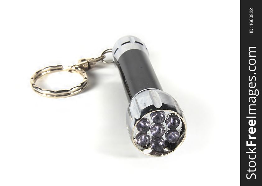 Black and silver flashlight on white background