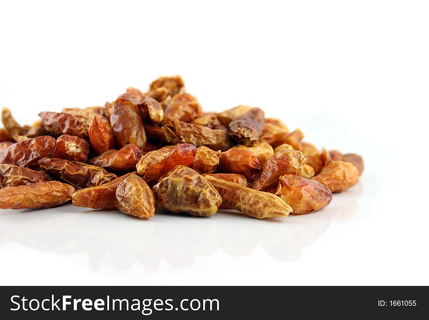 Close up of Dried Chilies on an isolated background shallow DOF