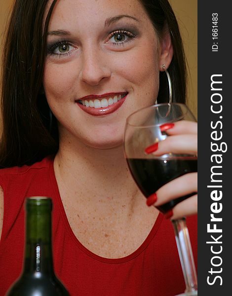 Gorgeous woman drinking red wine