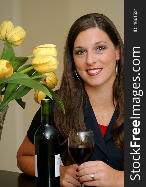 Gorgeous woman with wine & flowers