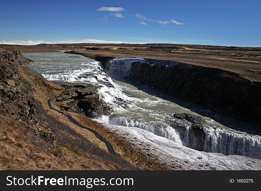 Gullfoss is a waterfall located on the White River (HvÃ­tÃ¡) in south central Iceland. Gullfoss is also by far Europeâ€™s most powerful waterfall. Gullfoss is an example of a waterfall forming where the water has followed a fissure in thelava and carved a passageway through it. Gullfoss is a waterfall located on the White River (HvÃ­tÃ¡) in south central Iceland. Gullfoss is also by far Europeâ€™s most powerful waterfall. Gullfoss is an example of a waterfall forming where the water has followed a fissure in thelava and carved a passageway through it.