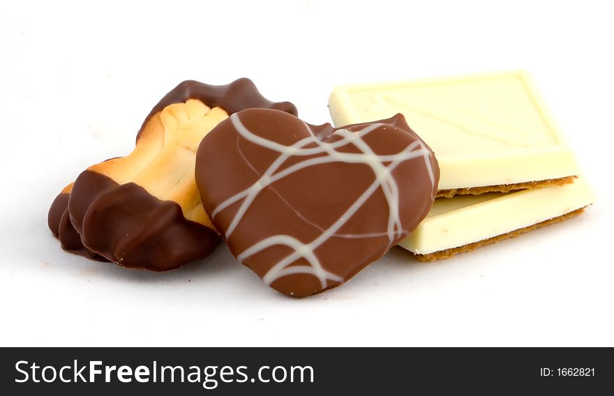 Several chocolate covered cookies on white background