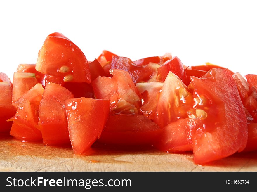 Fresh tomatoes cut into pieces. Fresh tomatoes cut into pieces