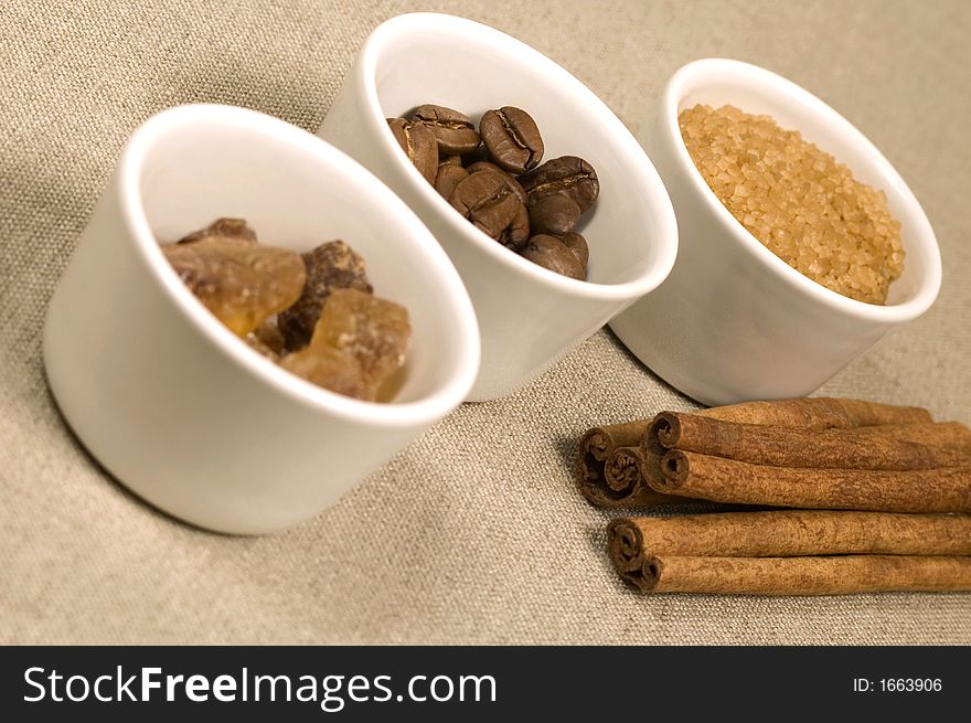 coffe beans, cinnamon and brown sugar. coffe beans, cinnamon and brown sugar