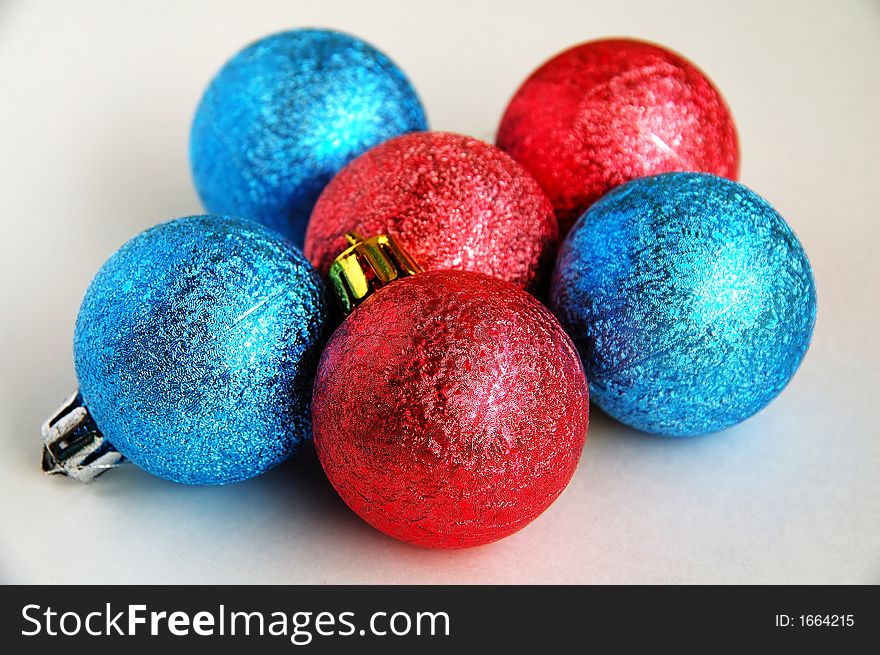 Six red and blue christmas blubs on white background