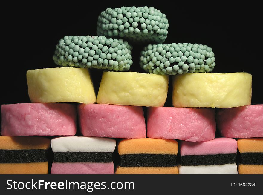Candies with different color on black background. Candies with different color on black background