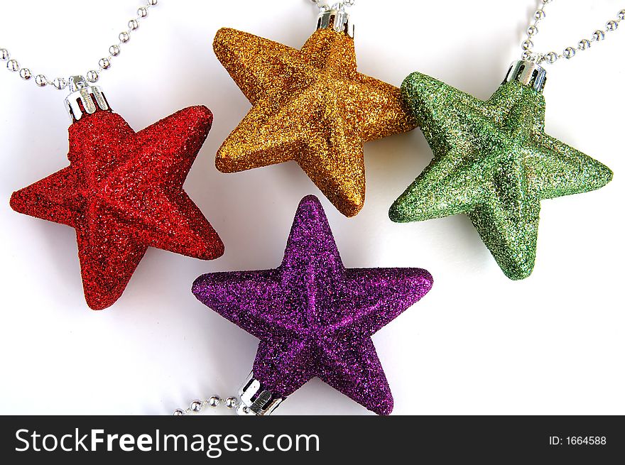 Four colorful christmas ornamental stars. Four colorful christmas ornamental stars