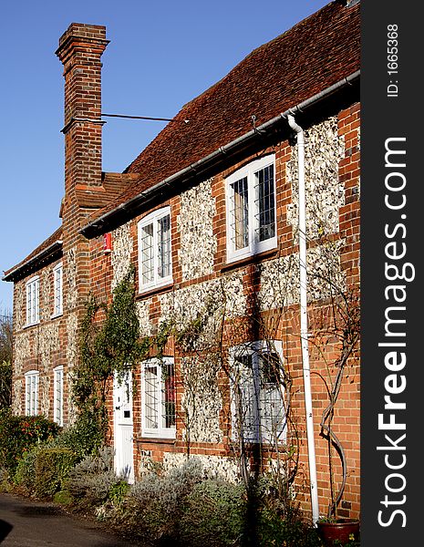 Quaint Row of Brick and Flint Cottages in Rural England. Quaint Row of Brick and Flint Cottages in Rural England