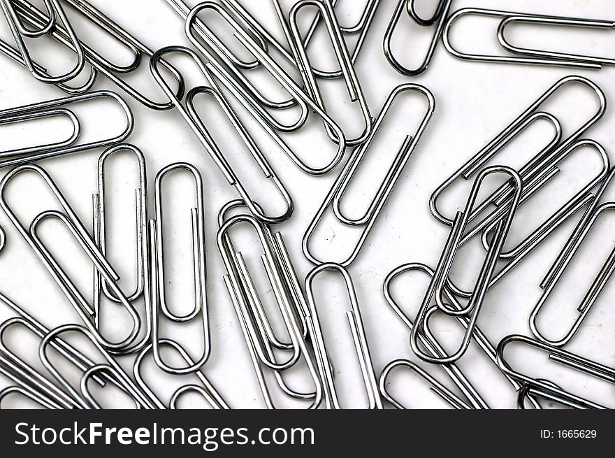 A set of paper clips against a white background