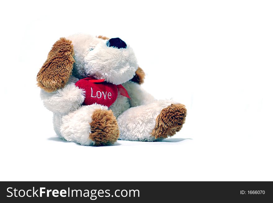 Teddy bear holding red hearth with text Love on white background. Teddy bear holding red hearth with text Love on white background